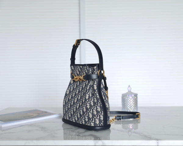 MONTAIGNE MEDIUM 24 BUCKET BAG IN BLUE OBLIQUE JACQUARD CALFSKIN