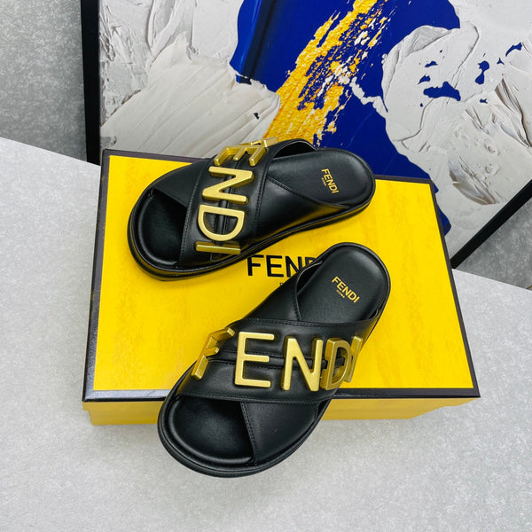 FENDI GRAPHY LOGO LETTERING SLIDES IN BLACK LAMBSKIN WITH GOLD HARDWARE