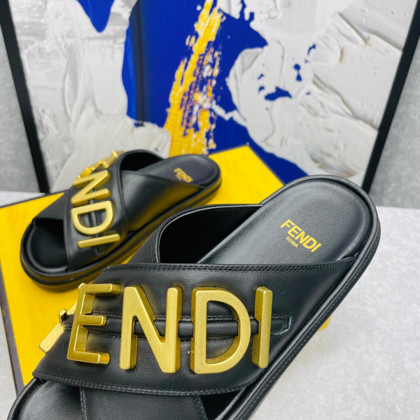 FENDI GRAPHY LOGO LETTERING SLIDES IN BLACK LAMBSKIN WITH GOLD HARDWARE