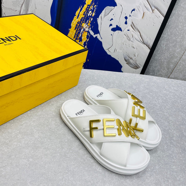 FENDI GRAPHY LOGO LETTERING SLIDES IN WHITE LAMBSKIN WITH GOLD HARDWARE