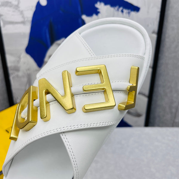 FENDI GRAPHY LOGO LETTERING SLIDES IN WHITE LAMBSKIN WITH GOLD HARDWARE