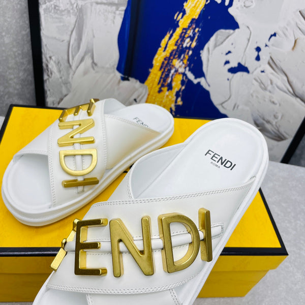 FENDI GRAPHY LOGO LETTERING SLIDES IN WHITE LAMBSKIN WITH GOLD HARDWARE
