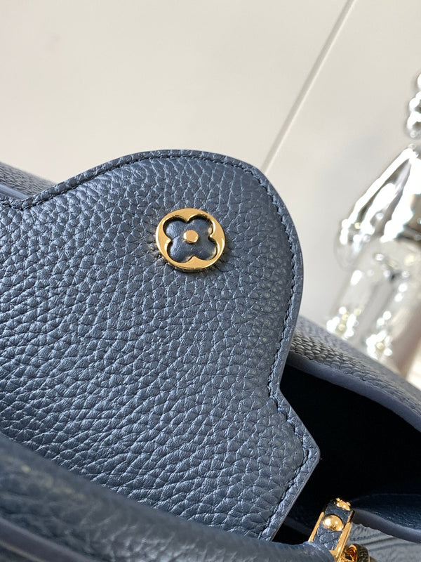 capucines bb 27 midnight blue taurillon leather gold hardware