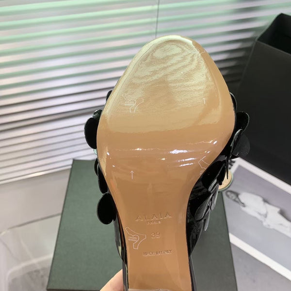 Mules in pelle Alaia Confetti in pelle di pecora nera lucida 293163