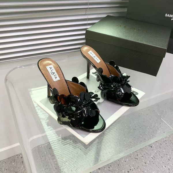 Mules in pelle Alaia Confetti in pelle di pecora nera lucida 293163