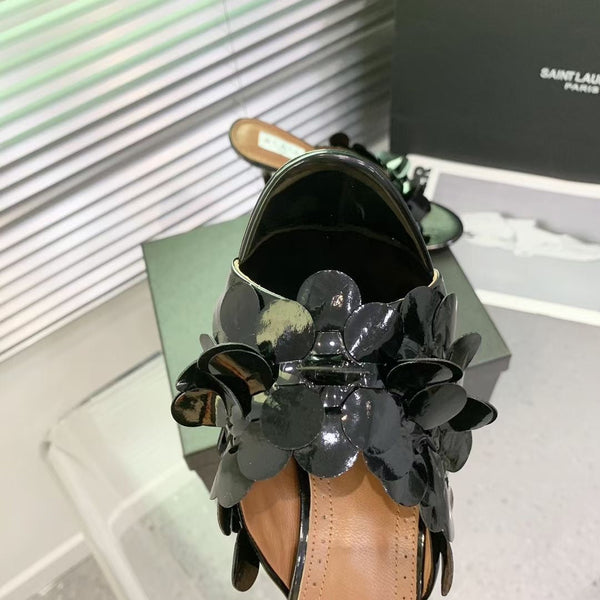 Mules in pelle Alaia Confetti in pelle di pecora nera lucida 293163