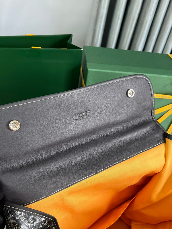 SAINT LÉGER BACKPACK 35 IN BLACK GOYARDINE CANVAS AND CALFSKIN WITH CARTOON PATCH