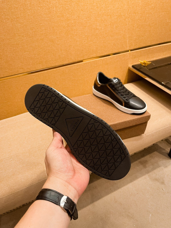 PRA SNEAKER IN BLACK CALFSKIN WITH GLOSSY GOLDEN