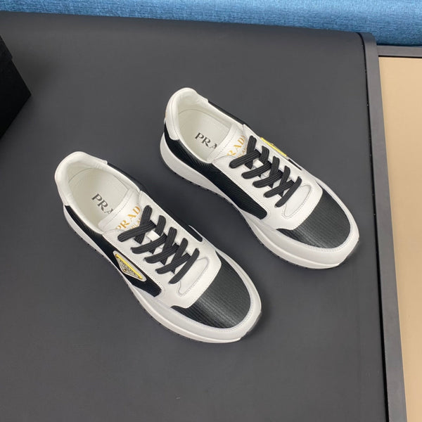 PRA SNEAKER IN WHITE CALFSKIN AND BLACK FABRIC WITH GOLDEN LOGO