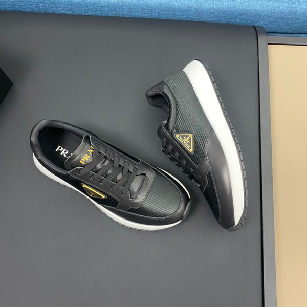 PRA SNEAKER IN BLACK CALFSKIN AND FABRIC WITH GOLDEN LOGO