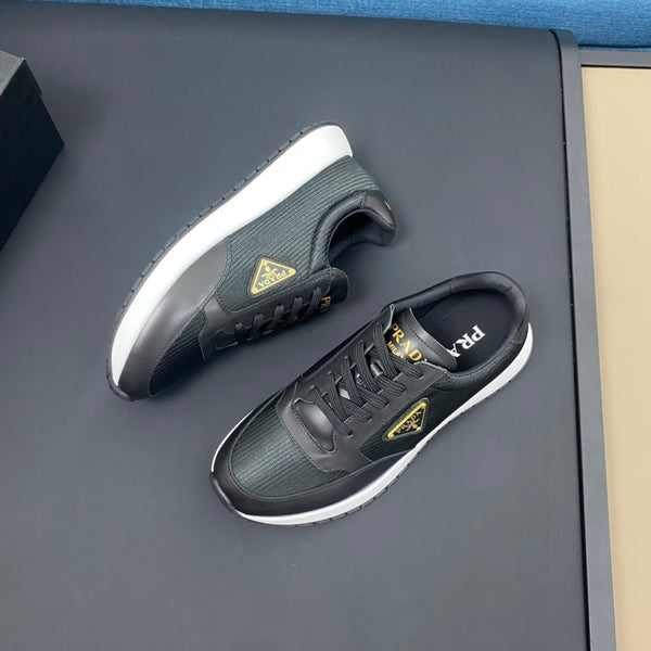 PRA SNEAKER IN BLACK CALFSKIN AND FABRIC WITH GOLDEN LOGO