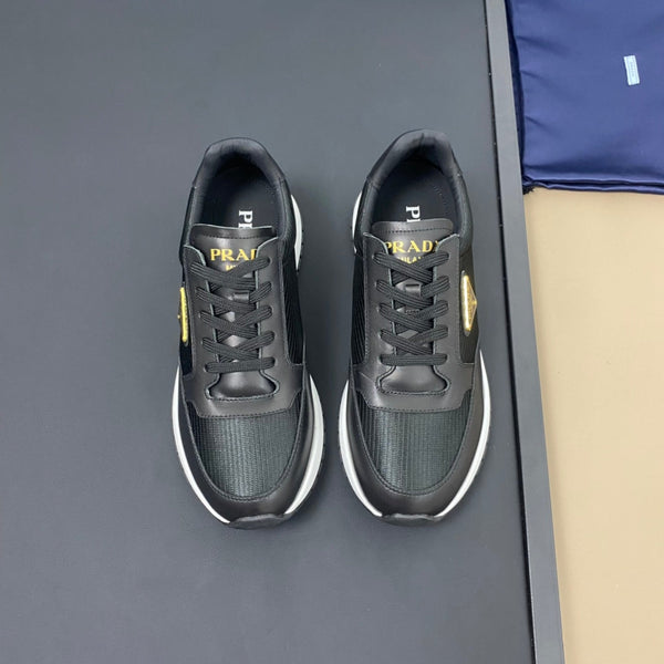 PRA SNEAKER IN BLACK CALFSKIN AND FABRIC WITH GOLDEN LOGO