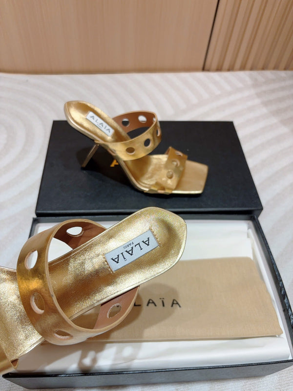 ALAIA TWO-STRAPS HIGH HEEL SANDALS IN GOLDEN PATENT LAMBSKIN