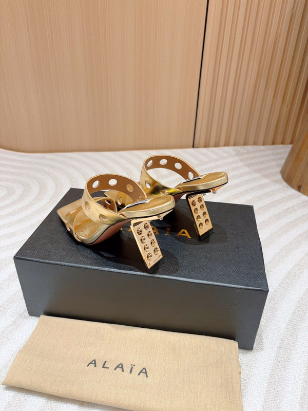 ALAIA TWO-STRAPS HIGH HEEL SANDALS IN GOLDEN PATENT LAMBSKIN