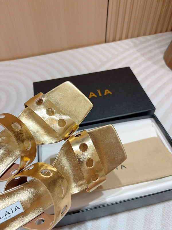 ALAIA TWO-STRAPS HIGH HEEL SANDALS IN GOLDEN PATENT LAMBSKIN