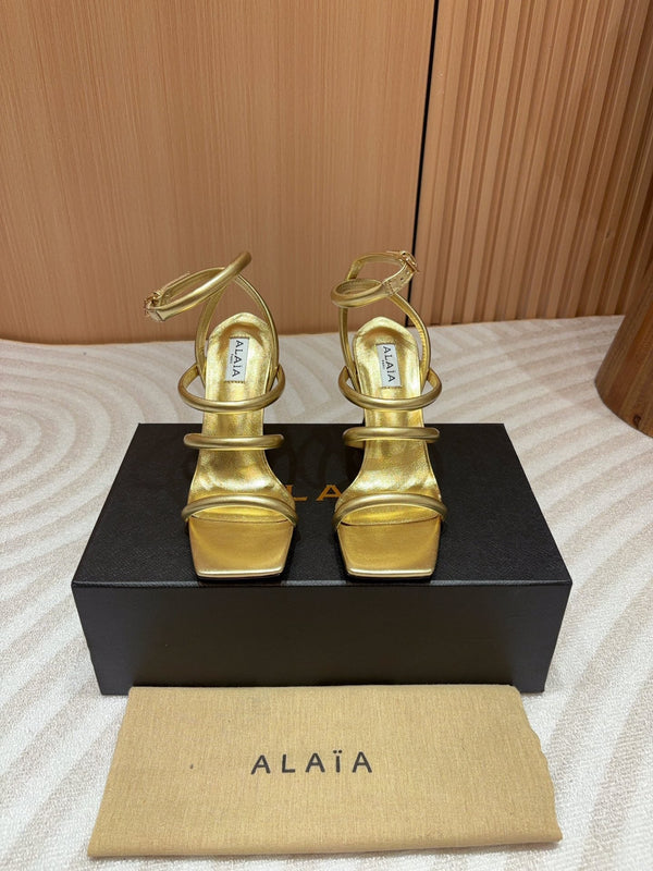 ALAIA THREE-STRAPS HIGH HEEL SANDALS IN GOLDEN PATENT LAMBSKIN