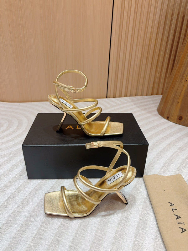 ALAIA THREE-STRAPS HIGH HEEL SANDALS IN GOLDEN PATENT LAMBSKIN
