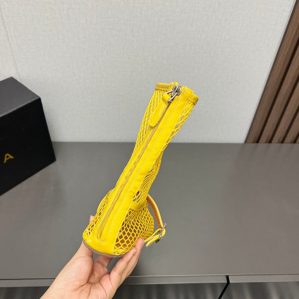 ALAIA SHORT BOOTS IN LEMON YELLOW MESH FISHNET