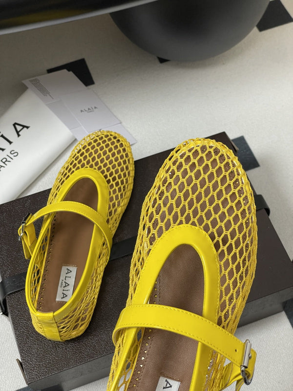 ALAIA BALLET FLATS IN YELLOW MESH FISHNET