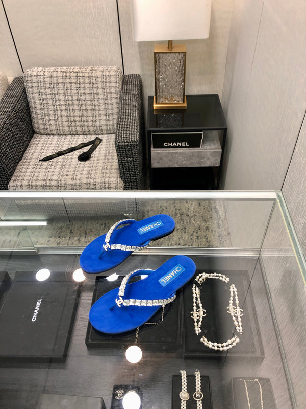 THONG SLIDE IN COBALT BLUE SUEDE WITH WHITE CRYSTALS