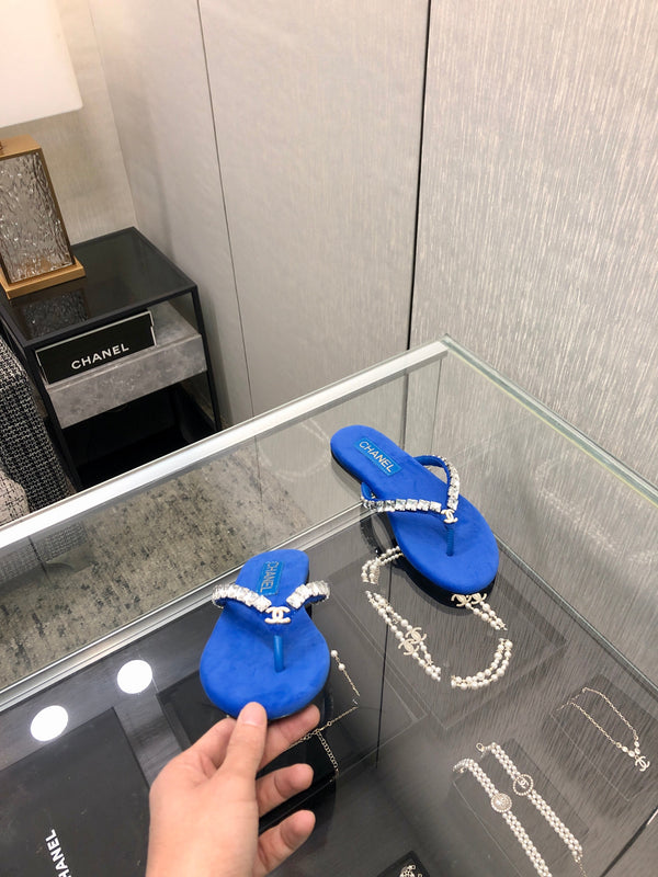 THONG SLIDE IN COBALT BLUE SUEDE WITH WHITE CRYSTALS