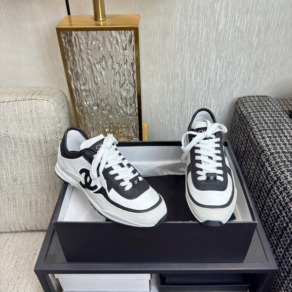 Chanel 2025 Sneaker Black and White Cowhite & Suede 507456