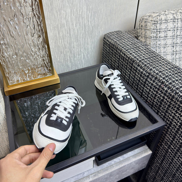 Chanel 2025 Sneaker Black and White Cowhite & Suede 507456