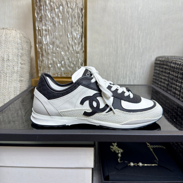 Chanel 2025 Sneaker Black and White Cowhite & Suede 507456