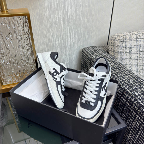 Chanel 2025 Sneaker Black and White Cowhite & Suede 507456