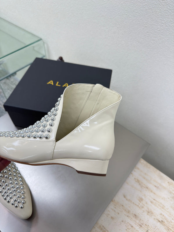 ALAIA Rivet ankle boots ivory cowhide leather 471092
