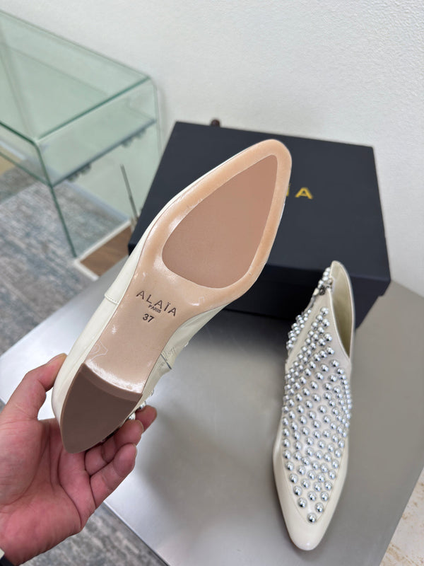 ALAIA Rivet ankle boots ivory cowhide leather 471092