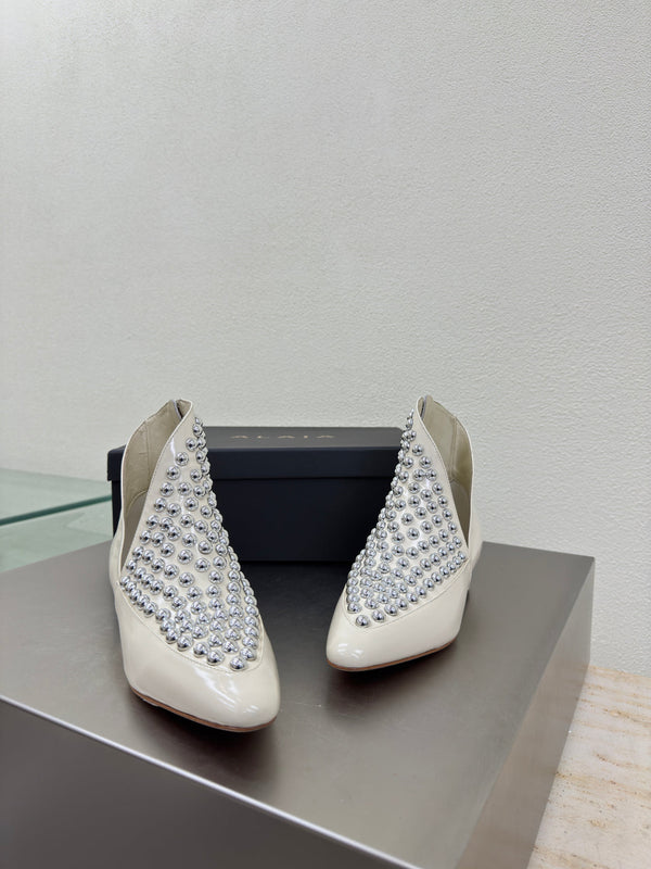 ALAIA Rivet ankle boots ivory cowhide leather 471092