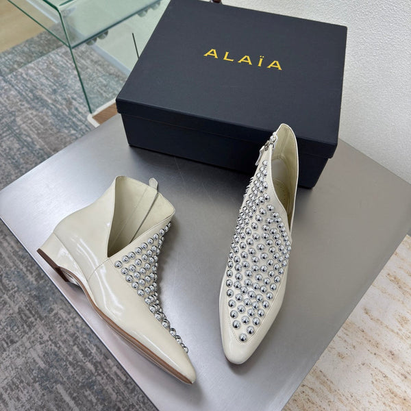 ALAIA Rivet ankle boots ivory cowhide leather 471092