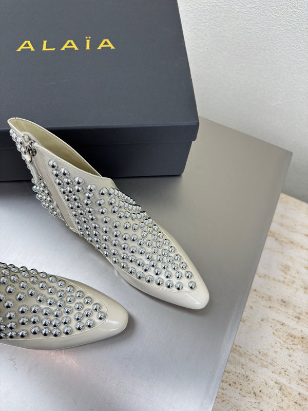 ALAIA Rivet ankle boots ivory cowhide leather 471092