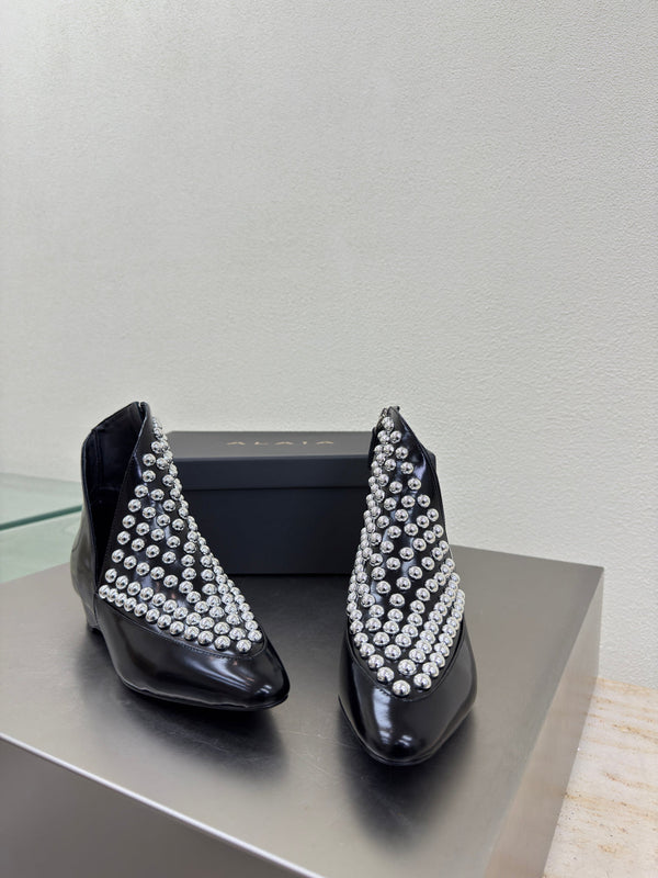 ALAIA Rivet ankle boots black cowhide leather 471093