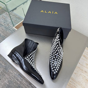 ALAIA Rivet ankle boots black cowhide leather 471093