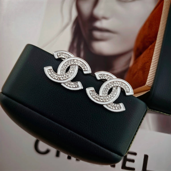 DOUBLE C STUD EARRINGS WITH WHITE TRIM AND CLEAR STONE LOGO