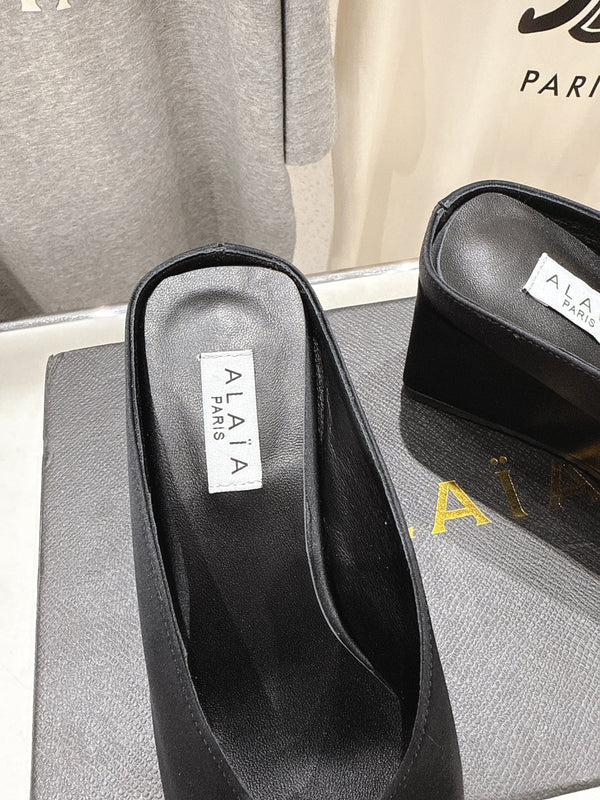 Alaia 25 Cube Wedge Mules Black Silk Sheepskin 300084