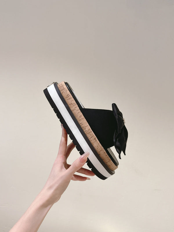 CC SLIPPERS WITH SILK BOW IN BLACK COWHIDE