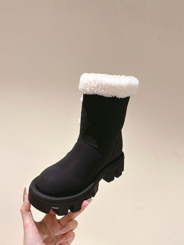 STIVALETTI IN PELLE DI VITELLO GOFFRATA NERA E SHEARLING BIANCO