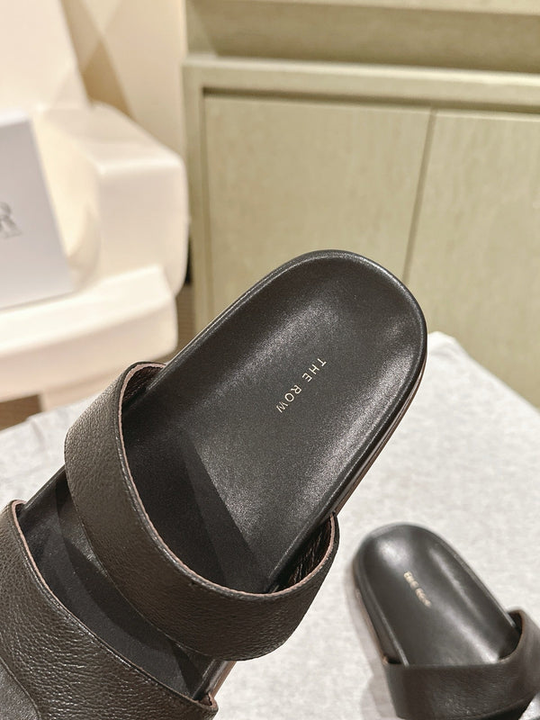 The Row Hugh Slides Black Cowhide Rubber 451281