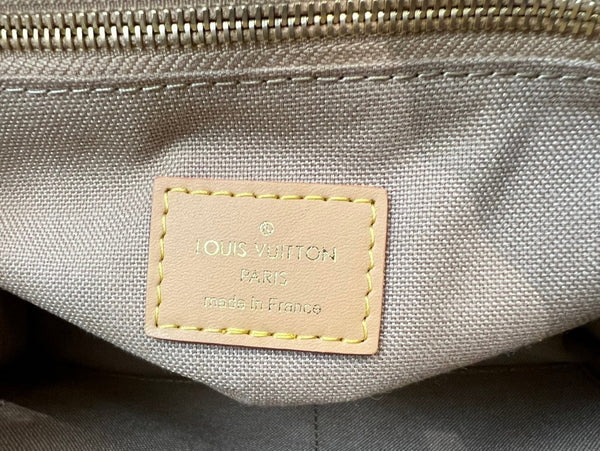 onthego pm 25 cream monogram empreinte embossed calfskin bagcharm