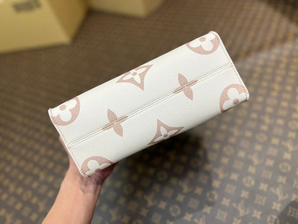 onthego pm 25 cream monogram empreinte embossed calfskin bagcharm