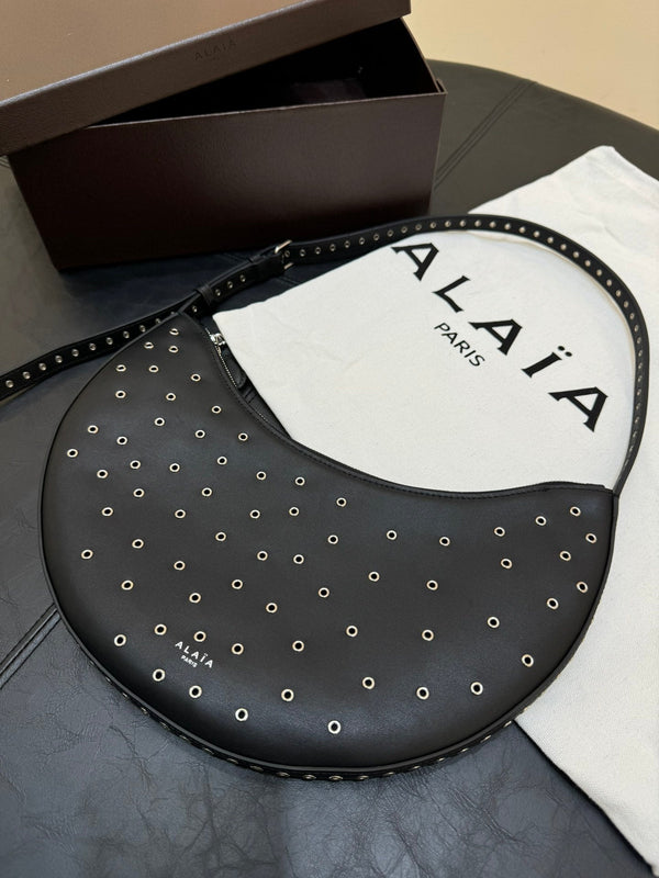 ONE PIECE DEMI LUNE BAG 31 IN BLACK SHEEPSKIN EYELET DETAILING