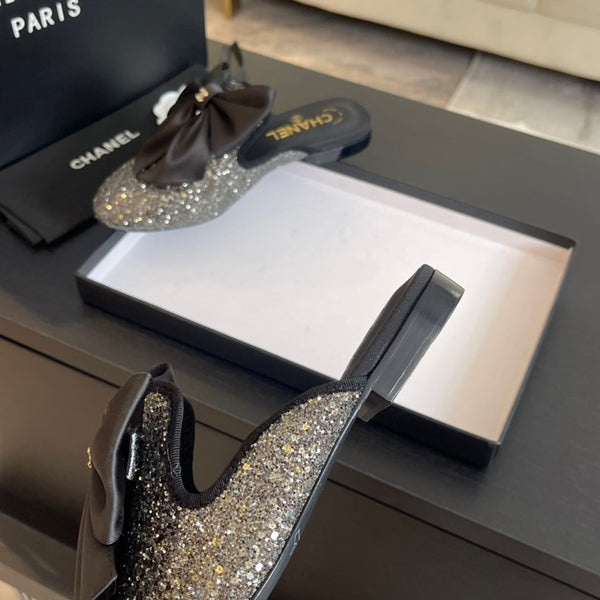 BIG BOW FLAT MULE SANDALS IN BLACK SILK WITH GLITTER SEQUINS
