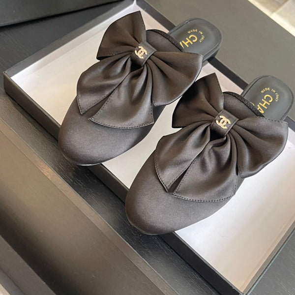 BIG BOW FLAT MULE SANDALS IN BLACK SILK
