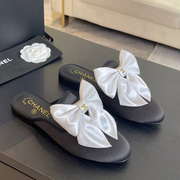 BIG BOW FLAT MULE SANDALS IN BLACK MIX WHITE SILK