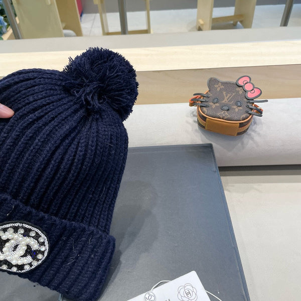 BERRETTO IN MAGLIA DI LANA BLU NAVY 430241