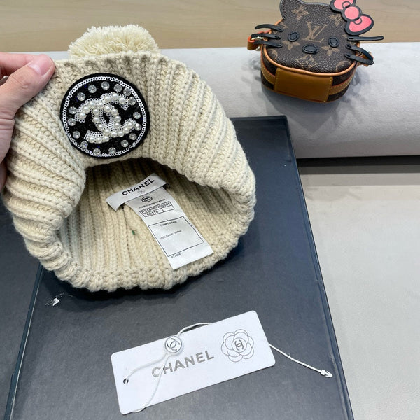 BERRETTO IN MAGLIA DI LANA BEIGE 430242