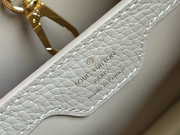 CAPUCINES BB 27 DARK BEIGE TAURILLON GOLD HARDWARE